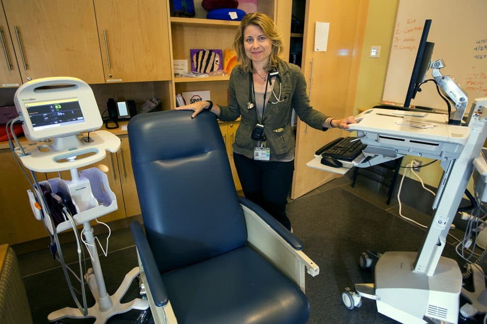 Dr. Jessie Gaeta, chief medical officer at the Boston Health Care for the Homeless Program, inside the conference room where heroin users are monitored while they ride out a high. (Jesse Costa/WBUR)