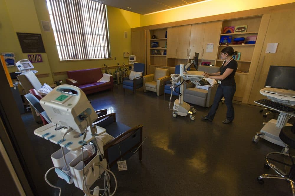 A nurse prepares seating for drug users in the Supportive Place for Observation and Treatment, or SPOT, at BHCHP. (Jesse Costa/WBUR)