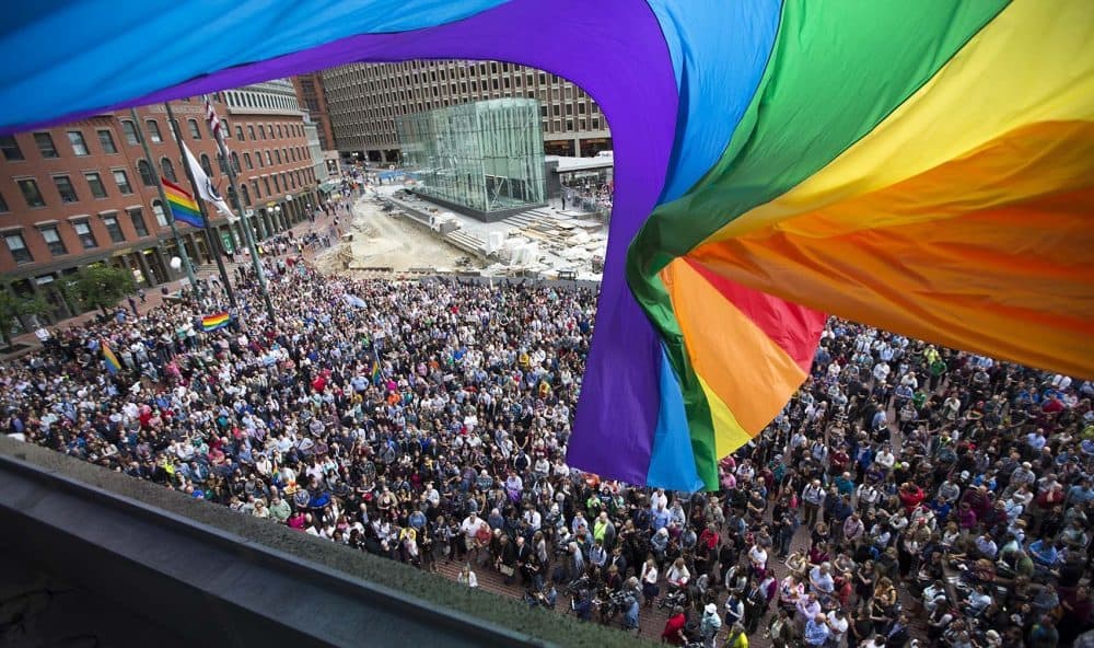 Joanna Weiss proposes a bipartisan shortlist of things we should be able to agree on, post-Orlando. Pictured: A vigil to honor victims of the Pulse nightclub massacre, Monday, June 13, 2016 at Boston's City Hall Plaza. (Jesse Costa/WBUR)