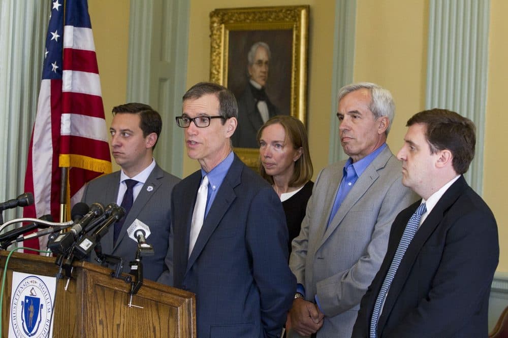 Sen. Joseph Boncore, Sen. William Brownsberger, Ivan and Martha Warmuth and Rep. Jay Livingstone announcing new proposed legislation Wednesday. (Joe Difazio for WBUR)