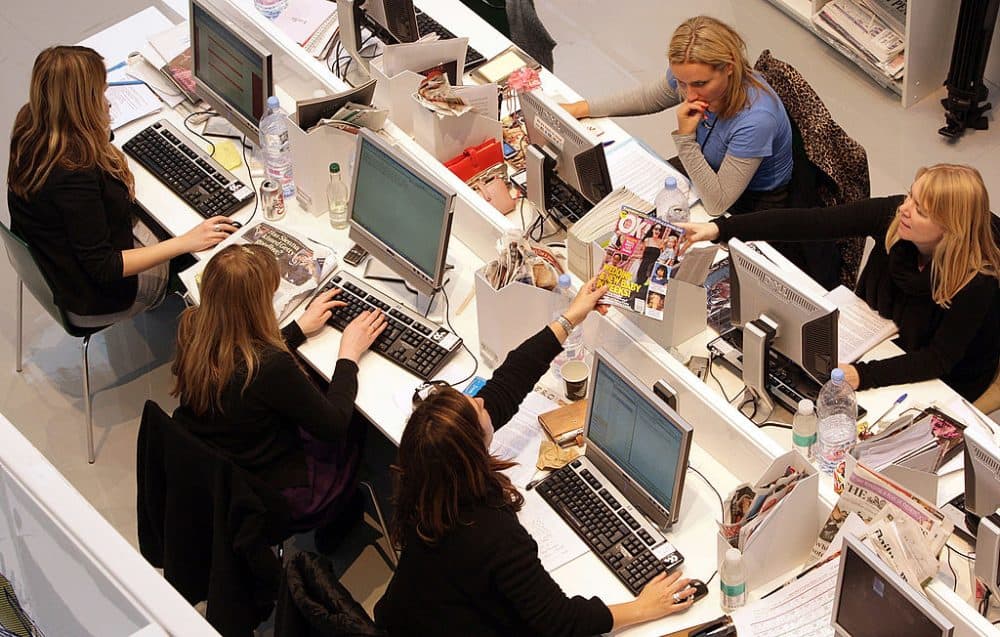 Production staff on the weekly fashion magazine, Grazia edit the magazine in a temporary office inside the Westfield shopping centre on November 3, 2008 in London. (Oli Scarff/Getty Images)