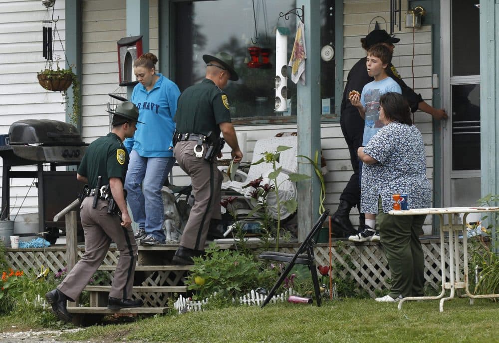 In this July 27, 2011, file photo New Hampshire State Police troopers enter the family home of Celina Cass, in Stewartstown, New Hampshire. (Charles Krupa/AP)