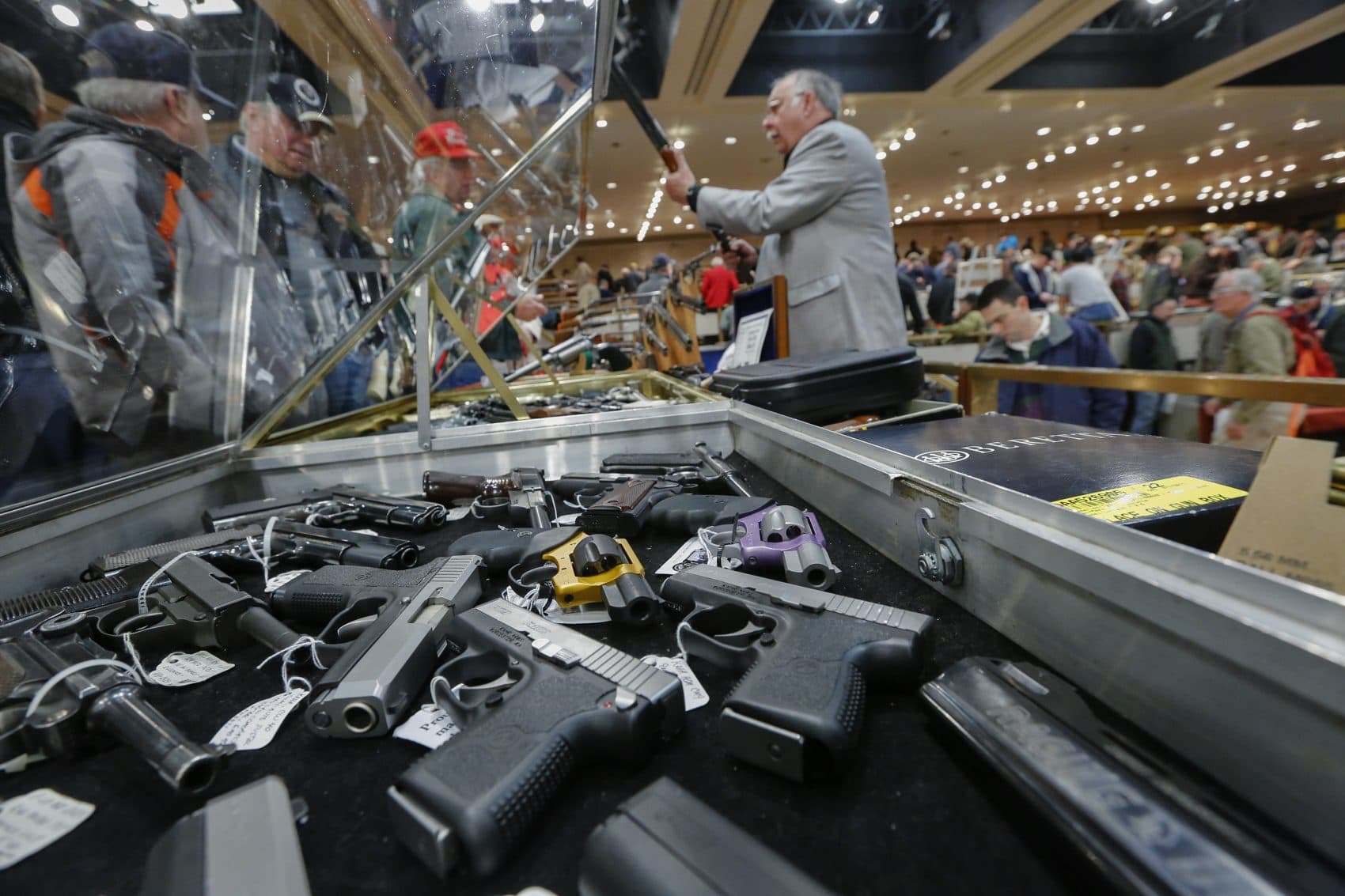 Guns on display at the annual New York State Arms Collectors Association Albany Gun Show in 2013. Without federal action on gun control, it falls to the states to create their own laws, or not. (Philip Kamrass/AP File)