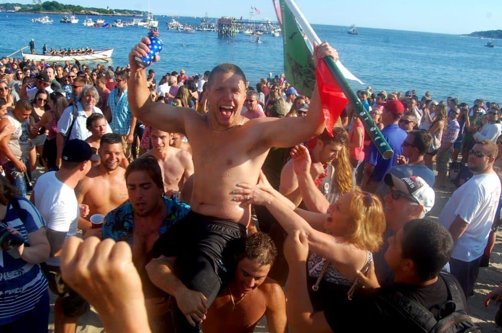 It was insane,” Mike Sanfilippo says after being carried up Gloucester’s Pavilion Beach upon winning the Greasy Pole contest on Friday, June 24, 2016. “It was the craziest thing. I got halfway, I got a little bit more, and then I was done. Literally, it’s the best thing that ever happened to me. I’ve been practicing since I was little.” (Greg Cook)