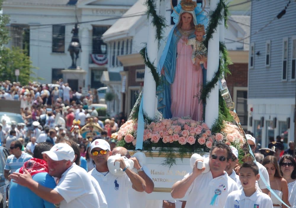 The Mother of Grace statue is carried up Washington Street in Gloucester during the St. Peter’s Fiesta Sunday procession, June 26, 2016. (Greg Cook)