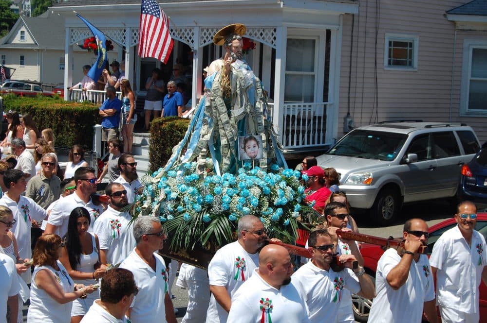 The St. Peter Statue is carried up Prospect Street in Gloucester during the St. Peter’s Fiesta Sunday procession, June 26, 2016. (Greg Cook)