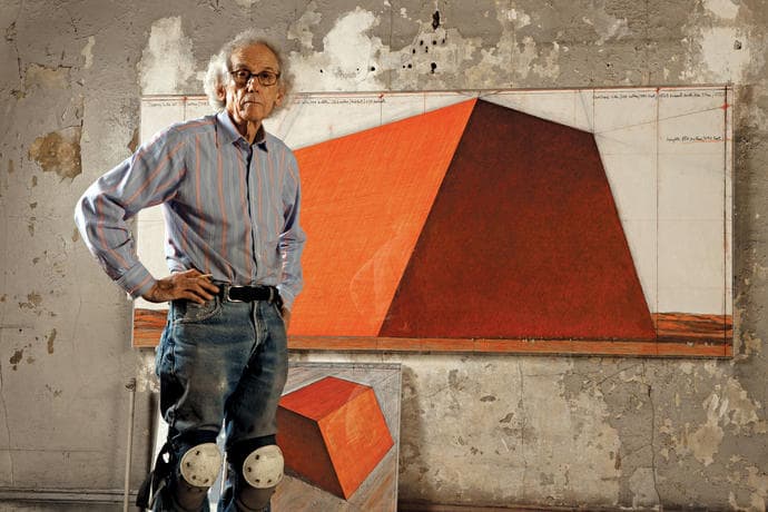 Christo in his studio with a preparatory drawing for &quot;The Mastaba,&quot; 2012. (Wolfgang Volz/Christo)