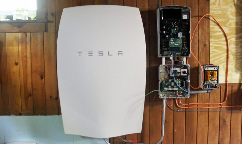 A Tesla Powerwall is seen in the basement of Miguel Orantes' southern Vermont home. (Kathleen Masterson/VPR)