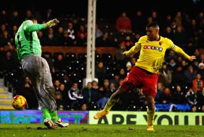 LONDON, ENGLAND - DECEMBER 05: Troy Deeney (R) of Watford scores past Gabor Kiraly the Watford goalkeeper during the Sky Bet Championship match between Fulham and Watford at Craven Cottage on December 5, 2014 in London, England. (Photo by Ker Robertson/Getty Images)