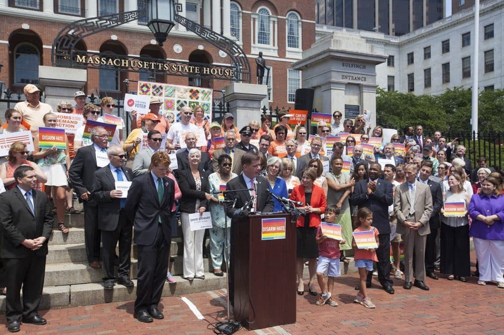 Boston Mayor Marty Walsh speaks at the Thursday rally, joined by U.S. Rep. Joseph Kennedy, U.S. Rep. Katherine Clark, state Attorney General Maura Healey, Suffolk Sheriff Steven Tompkins and Boston Police Commissioner William Evans. (Joe Difazio for WBUR)