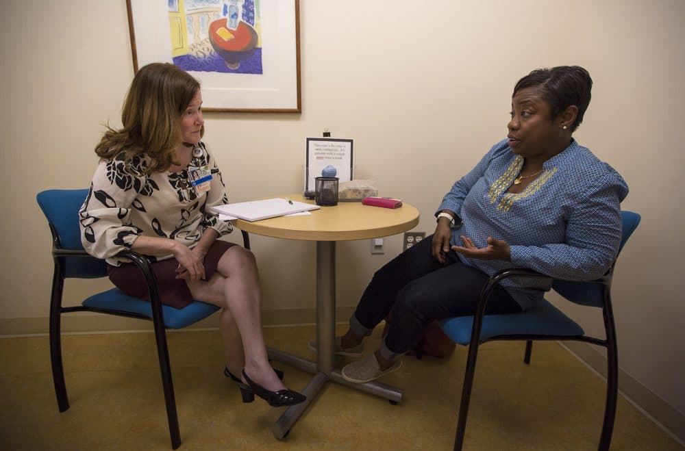 Marcia Chesterfield meets with her clinical social worker, Lara Sullivan, during a face-to-face check-in. (Jesse Costa/WBUR)