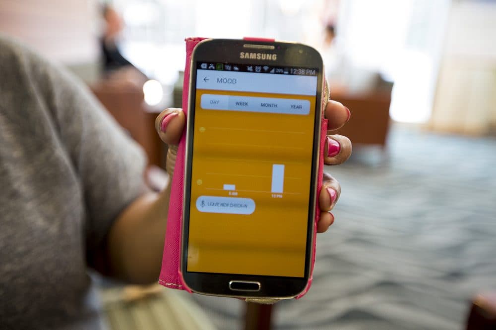 Marcia Chesterfield's mobile phone displays the Cogito Companion app. (Jesse Costa/WBUR)