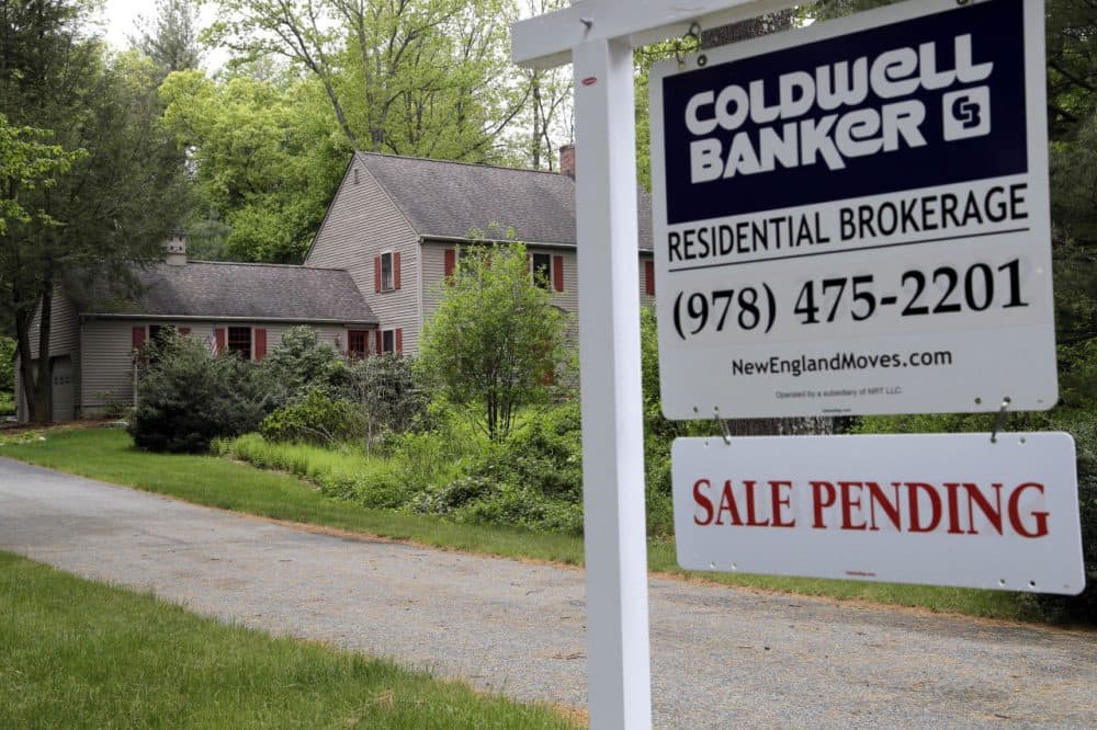 This 2016 file photo shows a &quot;Sale Pending&quot; sign in front of a house in North Andover. (Elise Amendola/AP)