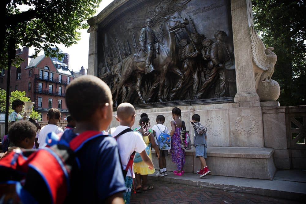 A group of elementary school students from Paige Academy in Roxbury approached the Shaw Memorial at the Boston Common. (Jesse Costa/WBUR)