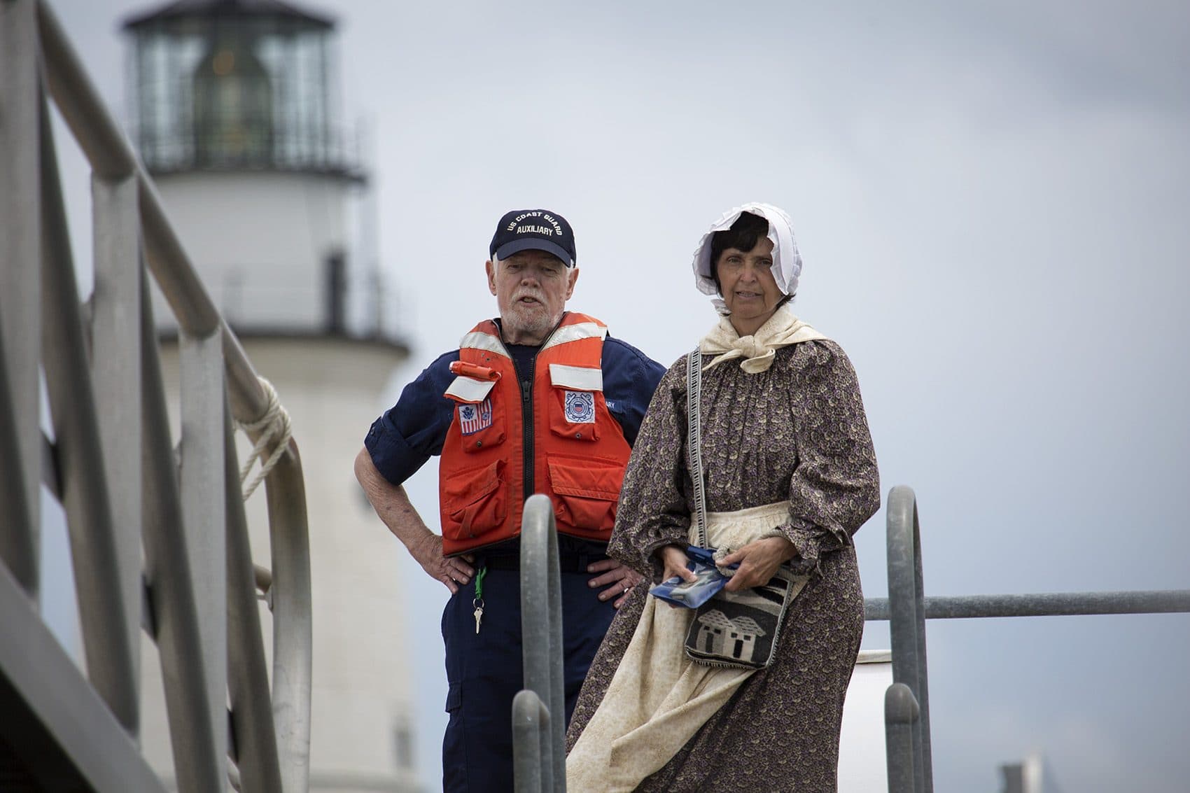 Sally Snowman and Coast Guard Auxillary volunteer worker Hugh Daughtry at the dock at Little Brewster Island. (Jesse Costa/WBUR)