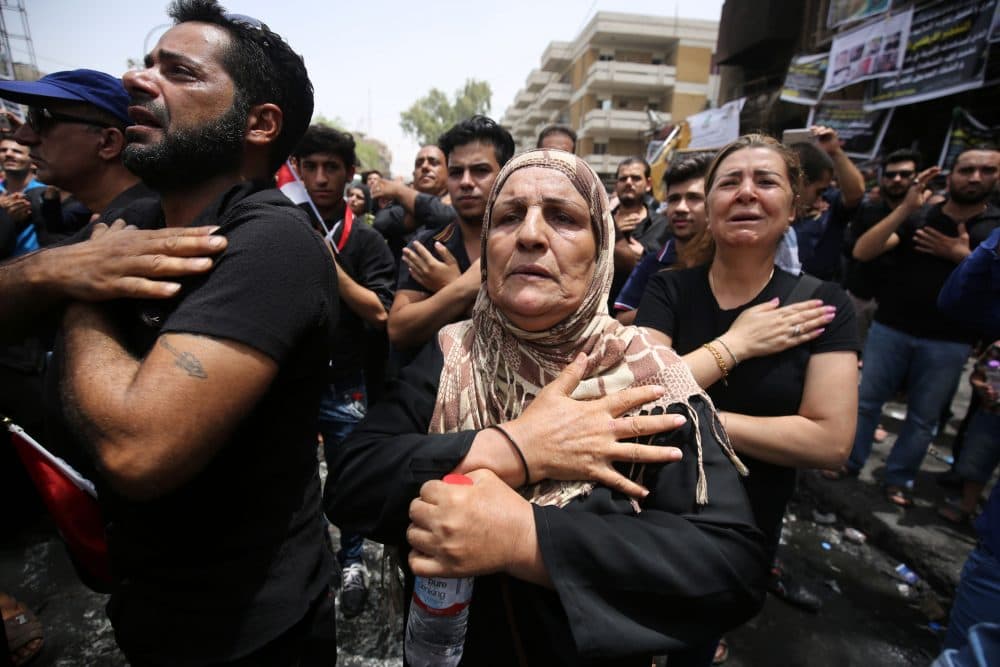 Iraqis beat themselves on the chest on July 6, 2016, as they mourn the victims of a suicide bombing that ripped through Baghdad's busy shopping district of Karrada on July 3.
The Baghdad bombing claimed by the Islamic State group killed at least 250 people, officials said on July 6, raising the toll of what was already one of the deadliest attacks in Iraq. (AHMAD AL-RUBAYE/AFP/Getty Images)
