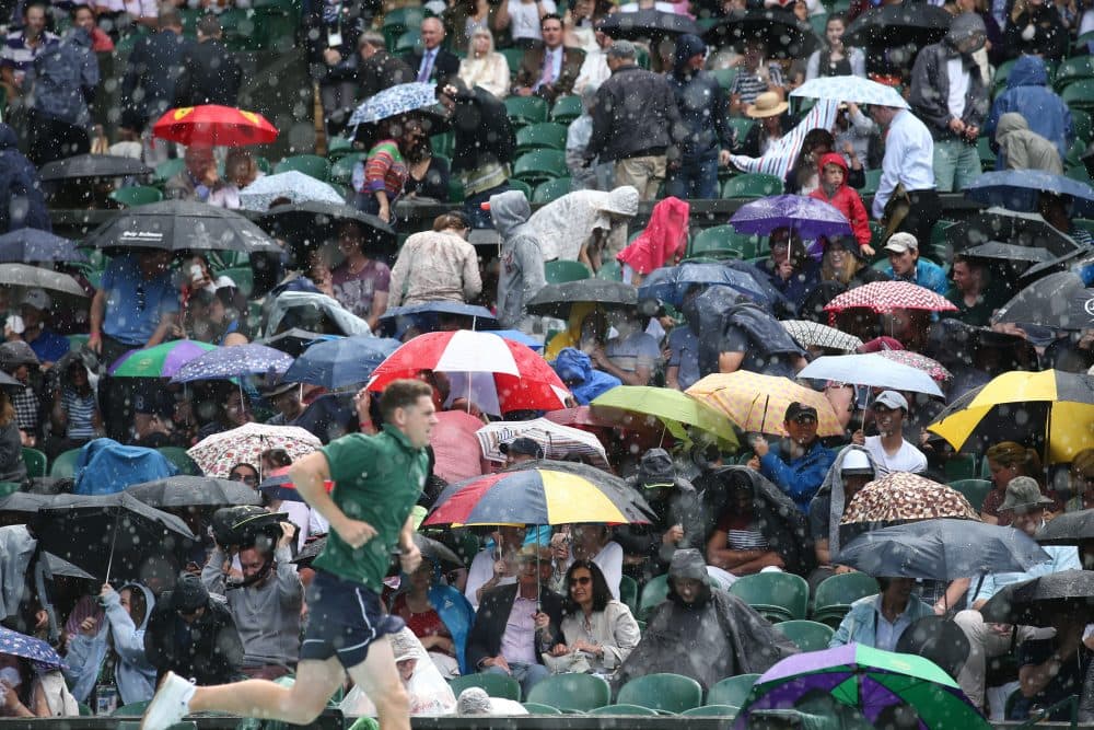 Rain majorly derailed the first week of Wimbledon, forcing the All England Club to open its gates on middle Sunday. ( Justin Tallis/AFP/Getty Images)