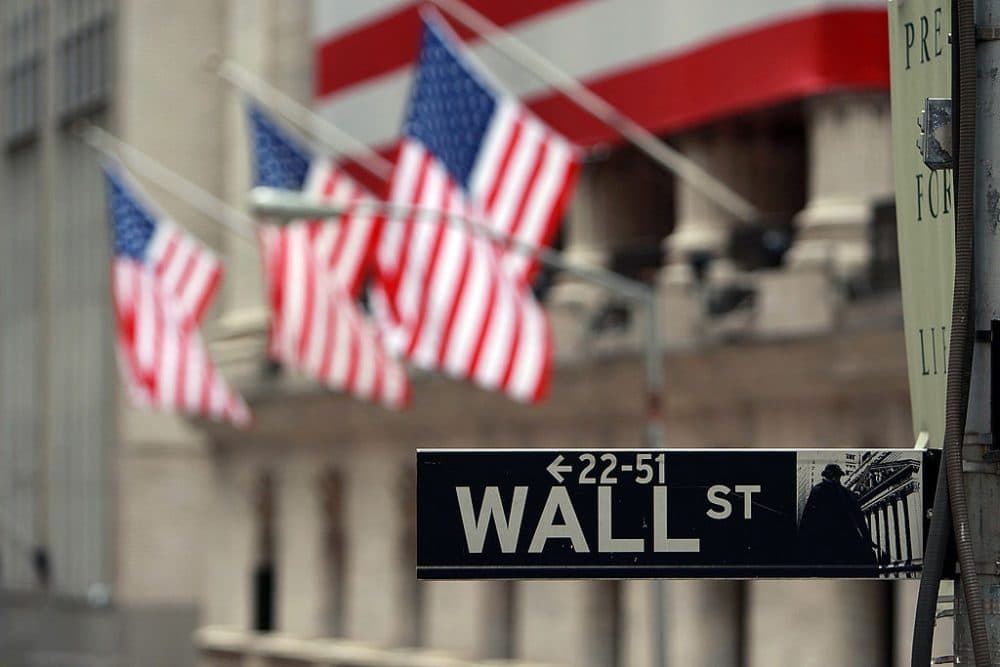 A Wall St. sign next to the New York Stock Exchange (NYSE) September 16, 2008 in New York City. (Spencer Platt/Getty Images)
