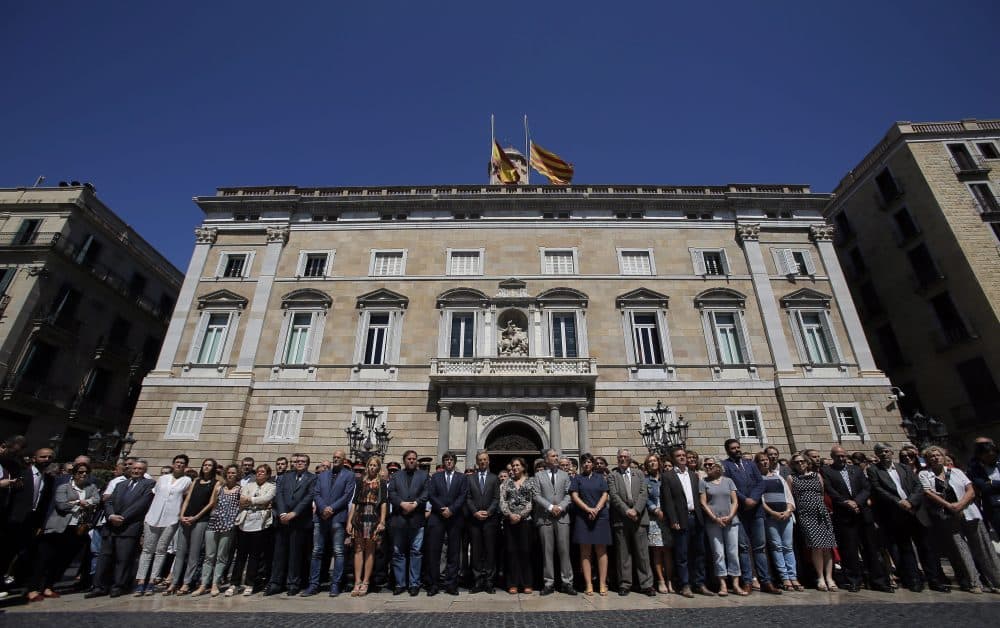 Catalan politics hold a minute of silence outside the Generalitat Palace, in Barcelona, Spain on Friday in honor of the victims of the Bastille Day tragedy in Nice, France. (Manu Fernandez/AP)