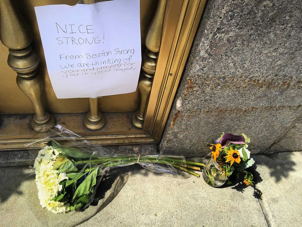 Flowers left outside the French Consulate in honor of the Nice victims. (Jesse Costa/WBUR)