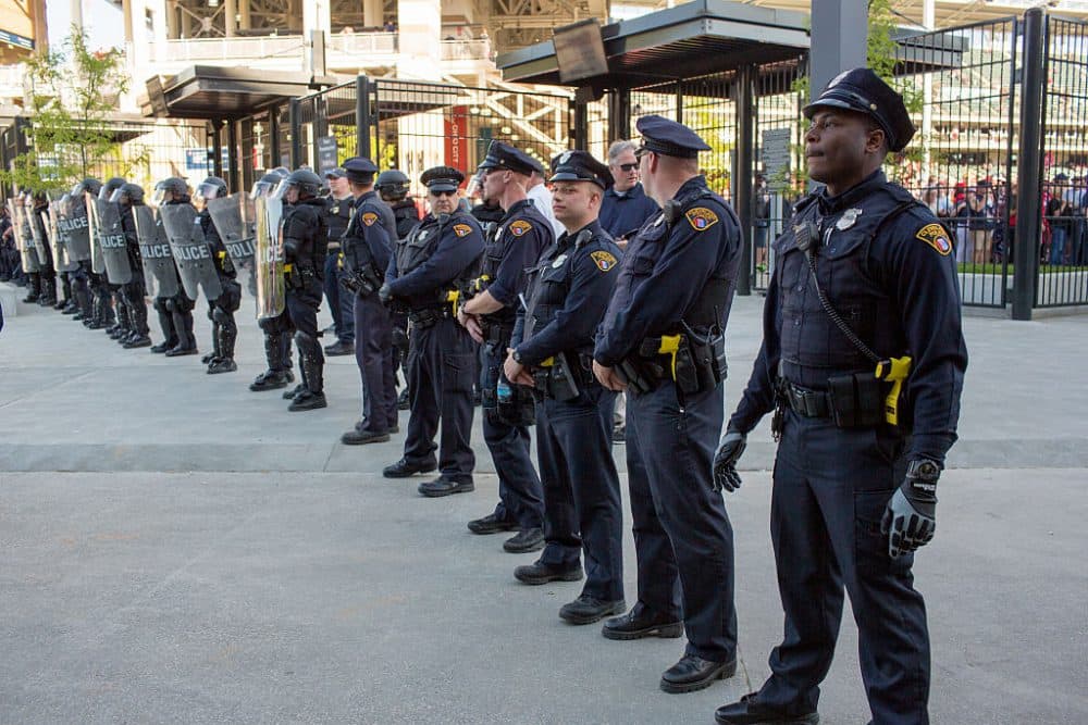 Police in front of Progressive Field stand guard during demonstrations in reaction to Cleveland police officer Michael Brelo being acquitted of manslaughter charges after he shot two people at the end of a 2012 car chase in which officers fired 137 shots May 23, 2015 in Cleveland, Ohio. (Ricky Rhodes / Stringer)