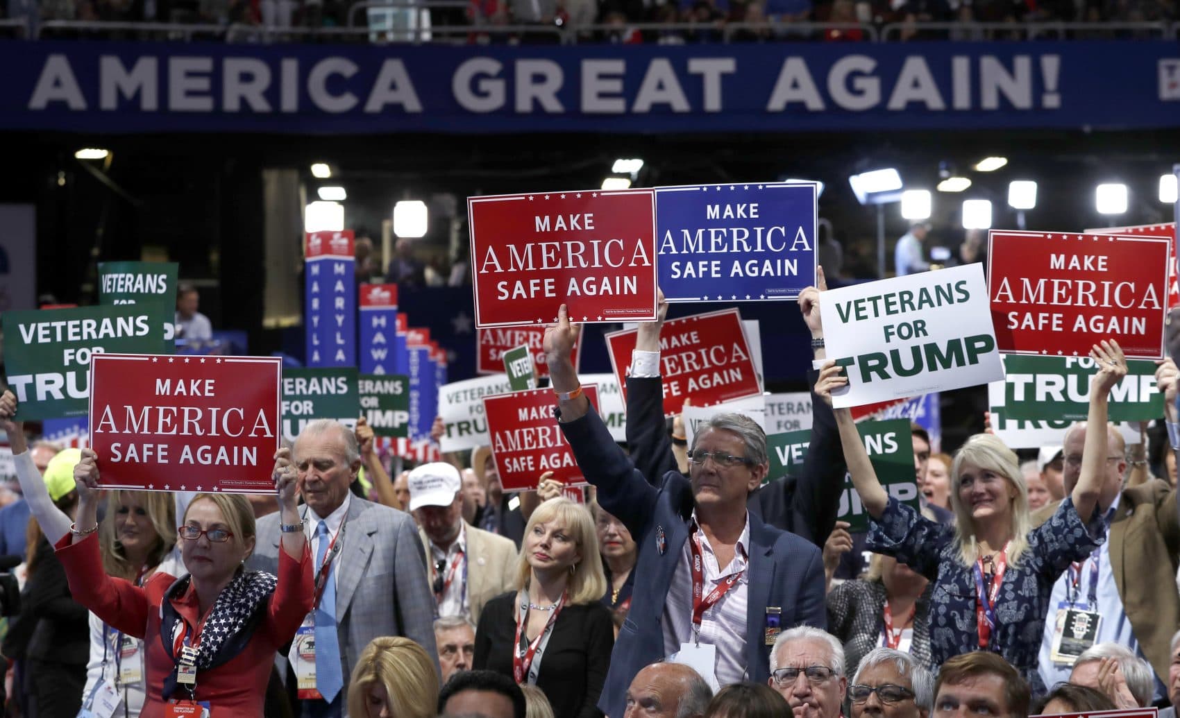 Delegates hold up signs and cheer Monday -- the first day of the Republican National Convention in Cleveland.(Carolyn Kaster/AP)