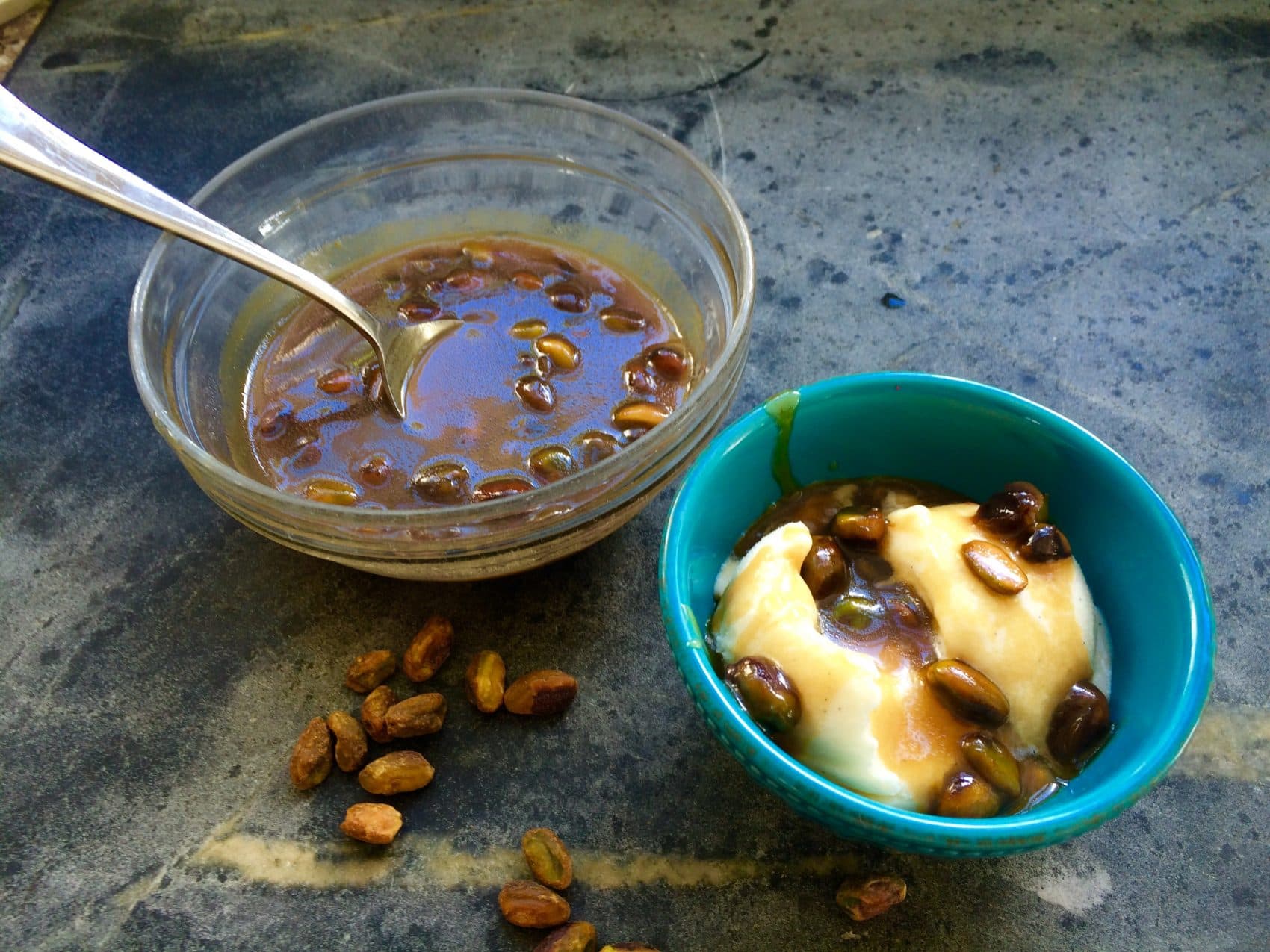 Kathy's sea salt-caramel-pistachio ice cream sauce drizzled over a bowl of ice cream. (Kathy Gunst for Here &amp; Now)