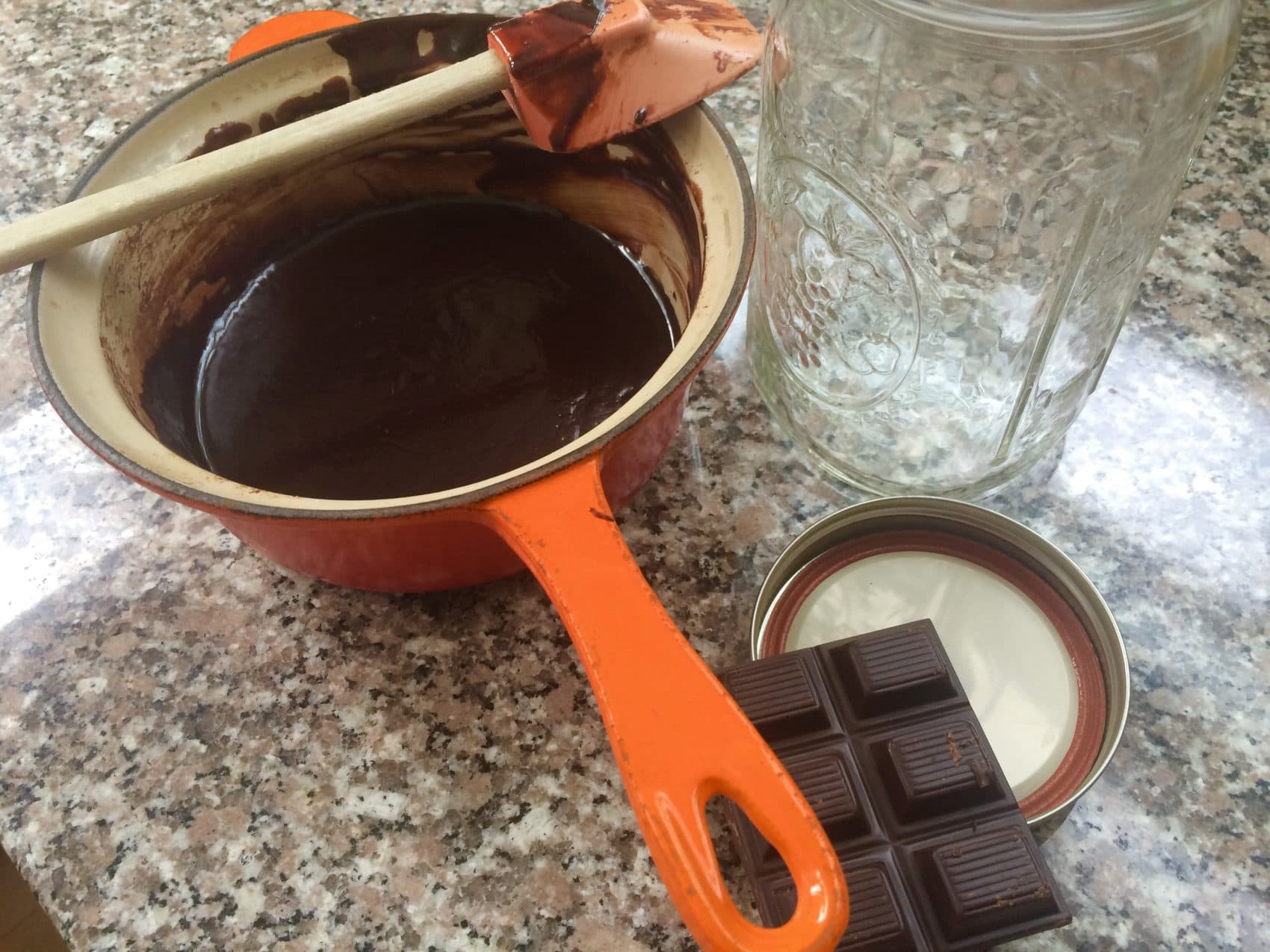 A pot containing melted dark chocolate, the key ingredient for Kathy's hot fudge sauce. (Kathy Gunst for Here &amp; Now)