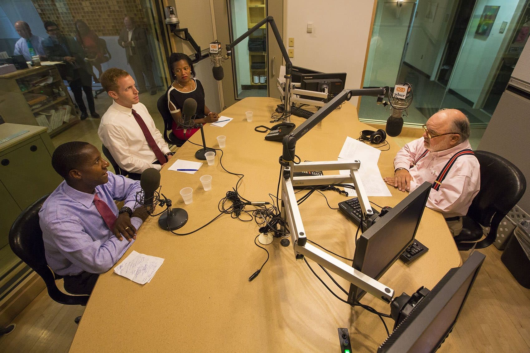 From left to right: Democratic delegates Newton Mayor Setti Warren, Holyoke Mayor Alex Morse and Mass. state Senator Linda Dorcena Forry speak with Bob Oakes in the WBUR studio. (Jesse Costa/WBUR)