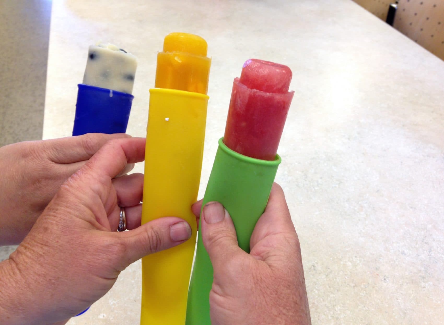 Kathy's maple yogurt-blueberry (left), mango (middle) and watermelon-lime (right) popsicles. (Jackson Mitchell/Here &amp; Now)