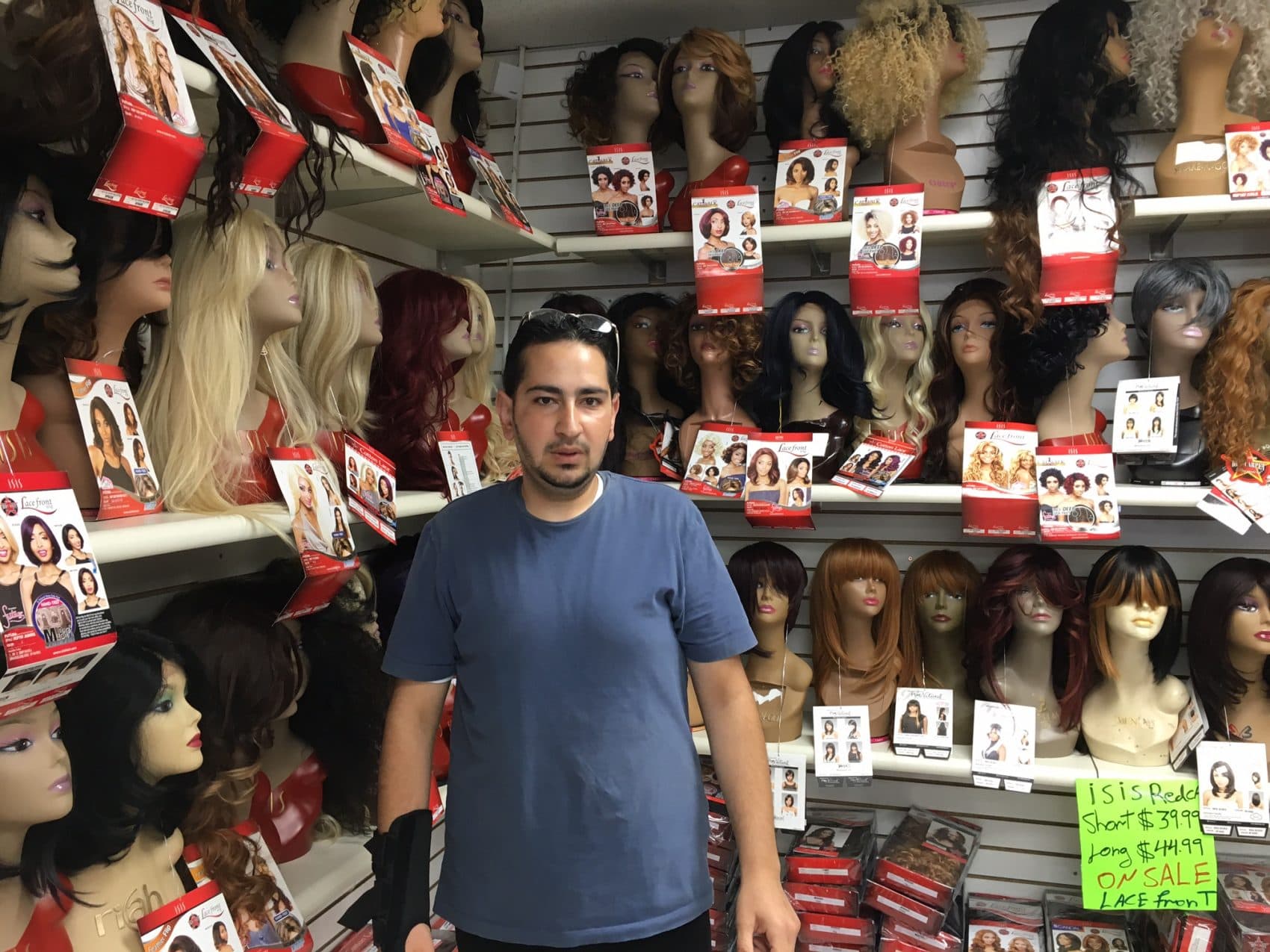 Mohammed, a Syrian refugee, at Shaker Hair & Beauty Supply in Cleveland Heights, Ohio, where he works. (Jill Ryan/Here & Now)