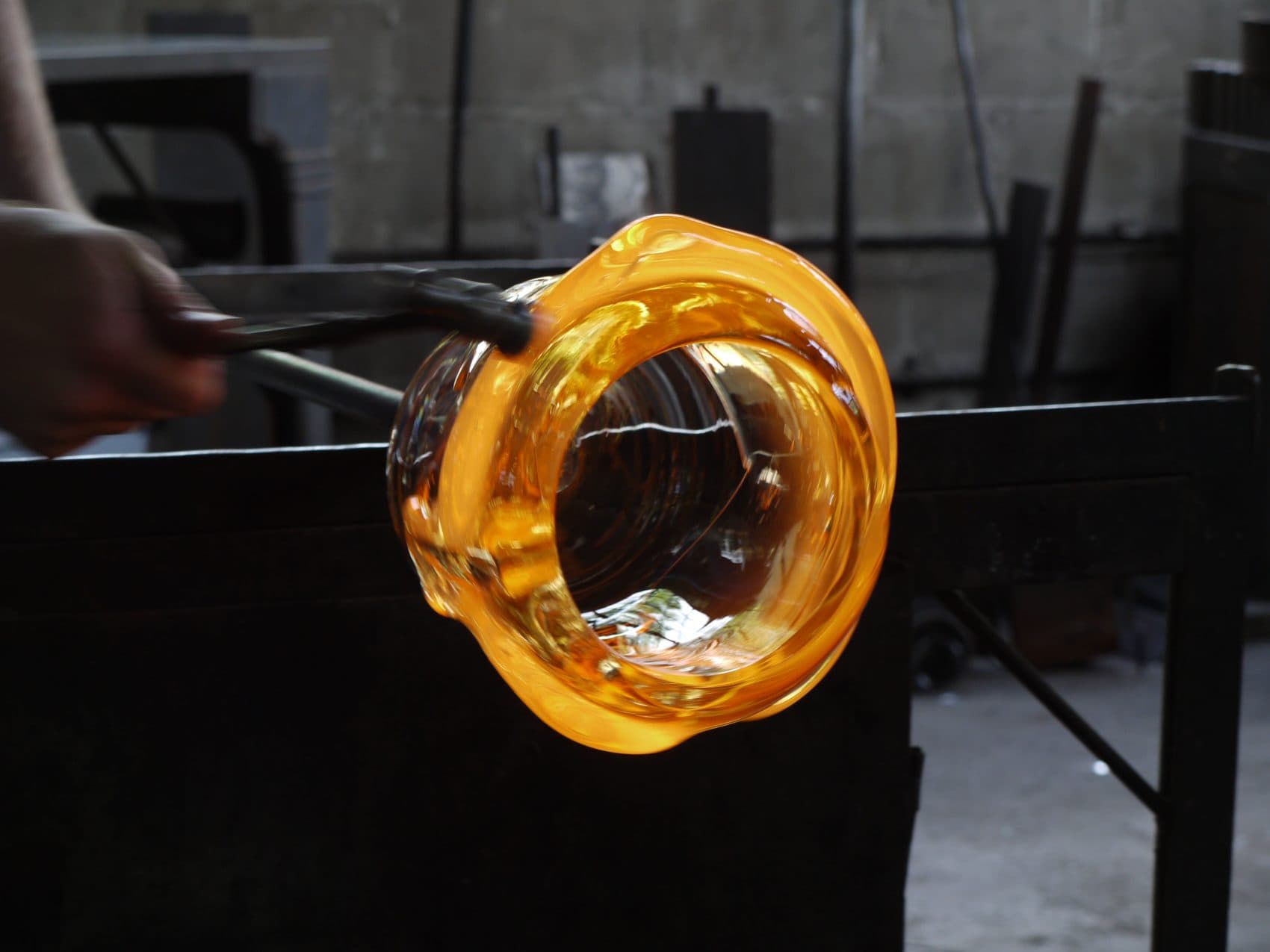 A glass bowl being made in the Cleveland Art workshop. (Alex Ashlock/Here &amp; Now)