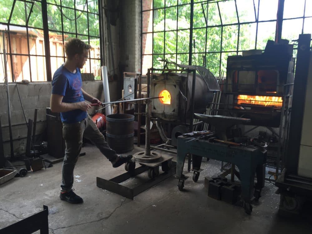 Glassblower Chris Adamick at work in the Cleveland Art workshop. (Robin Young/Here & Now)