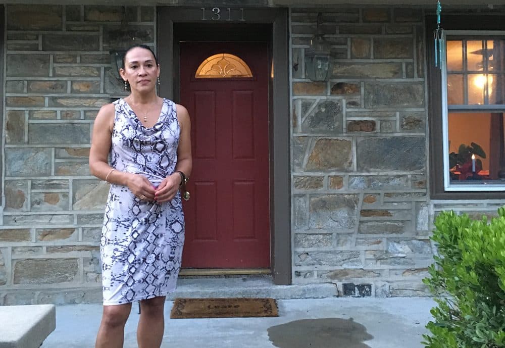 Anita Colon stands outside her house in Philadelphia. Her brother, Robert Holbrook, was sentenced to life in prison without the possibility of parole in 1990, at the age of 16. (Samantha Fields/Here &amp; Now)