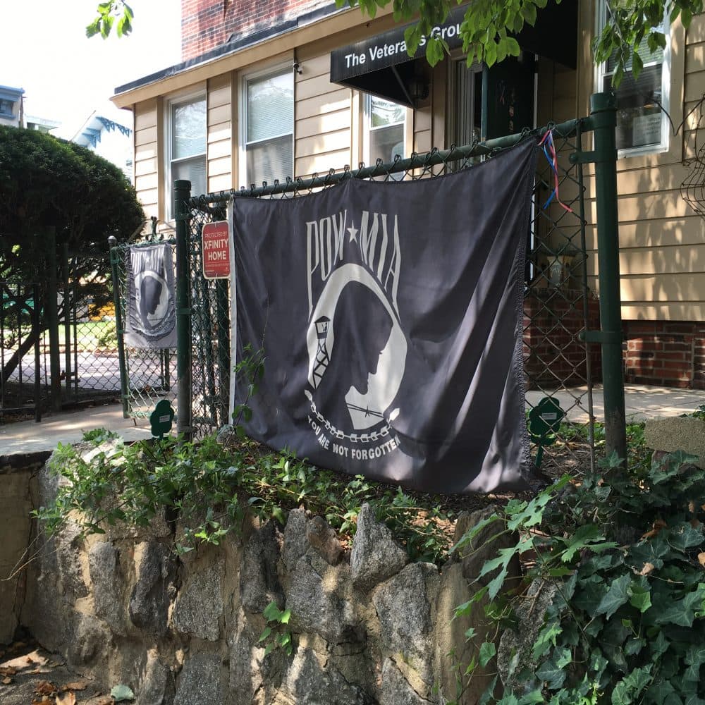 A POW/MIA flag hangs outside The Veterans Group building in Philadelphia. (Alex Ashlock/Here &amp; Now)