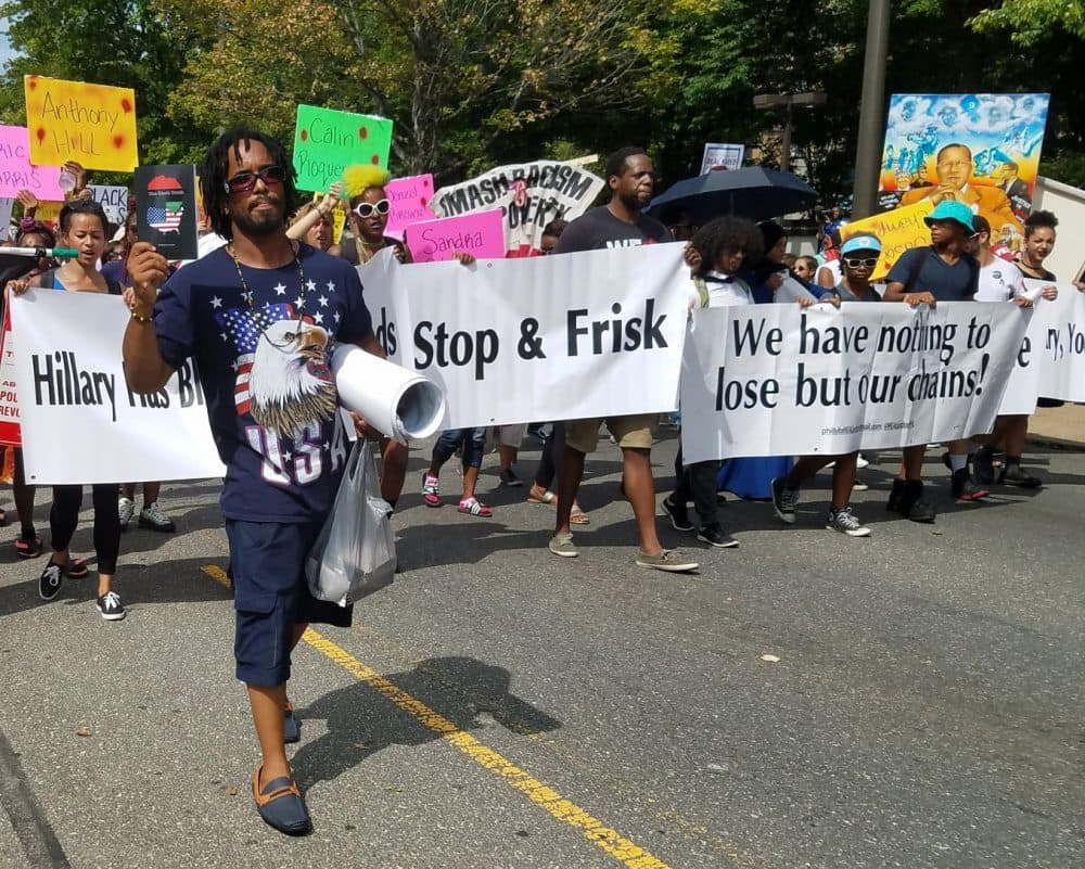 Protesters march through Philadelphia on Tuesday. (Zeninjor Enwemeka/WBUR)
