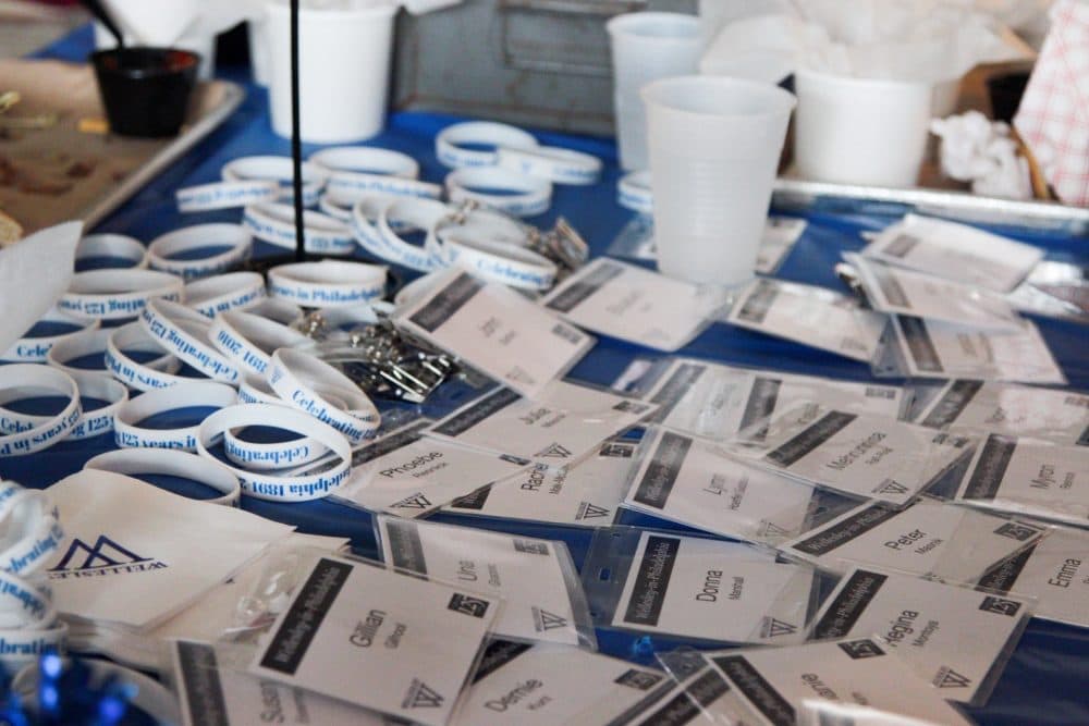 Name tags are spread at a table at the Philadelphia Wellesley College Club during a celebration for Hillary Clinton's nomination. (Samantha Fields/Here &amp; Now)