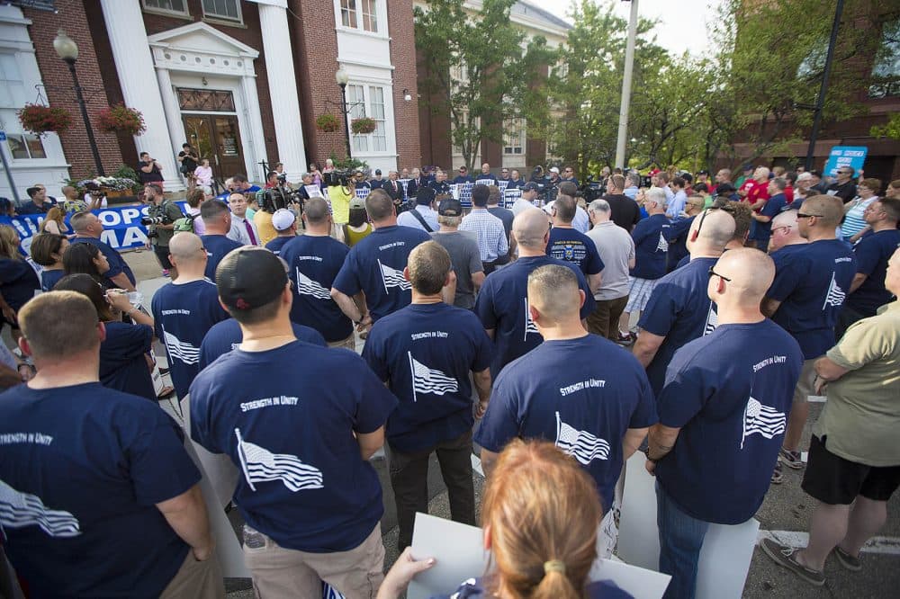 Police officers protesting outside of Somerville City Hall. (Jesse Costa/WBUR)