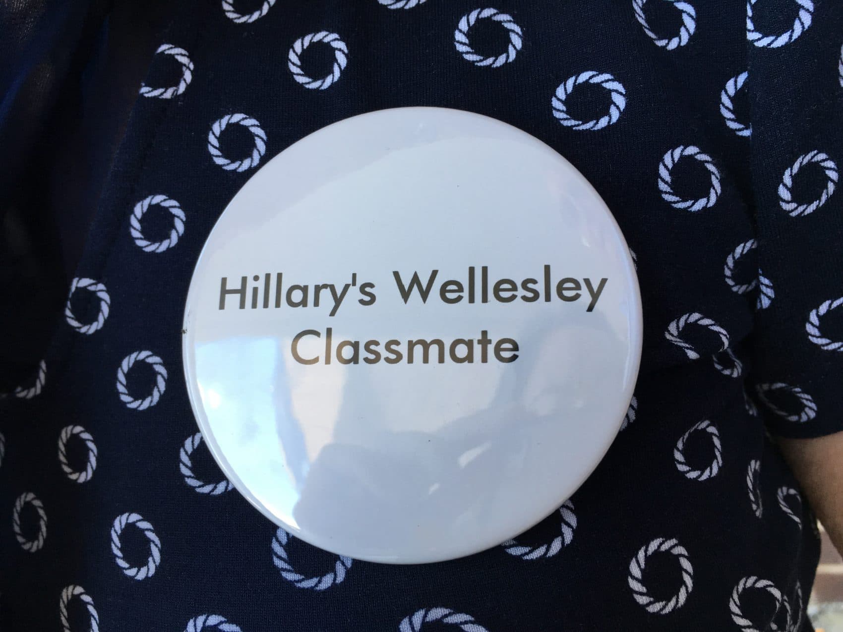A &quot;Hillary's Wellesley Classmate&quot; button, pinned to Suzanne Salomon's shirt. (Samantha Fields/Here &amp; Now)