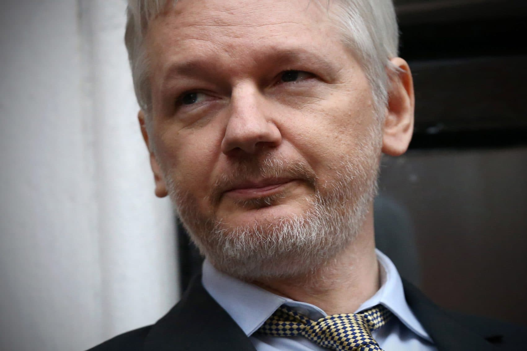 WikiLeaks founder Julian Assange speaks from the balcony of the Ecuadorian embassy on Feb. 5, 2016 in London, England. (Carl Court/Getty Images)