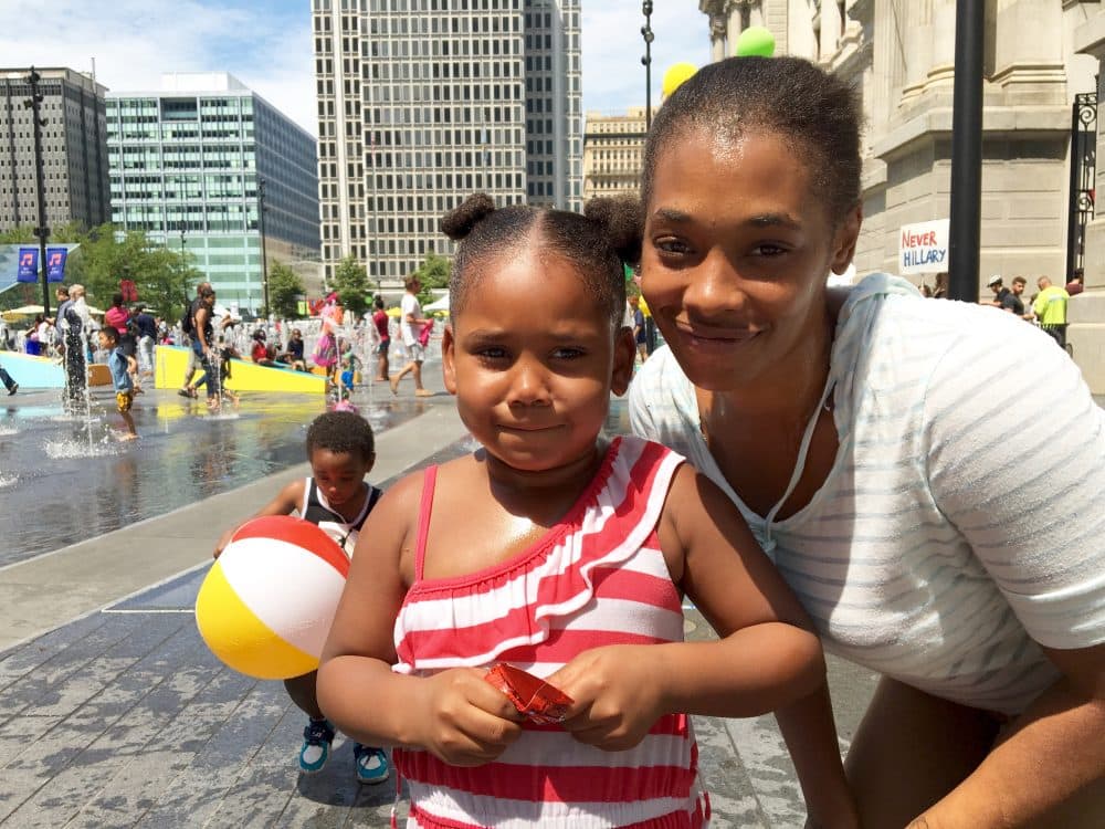 Quamesha Brown and her daughter Quadarah enjoy a day of free children's activities at City Hall Plaza in Philadelphia. (Shannon Dooling/WBUR)