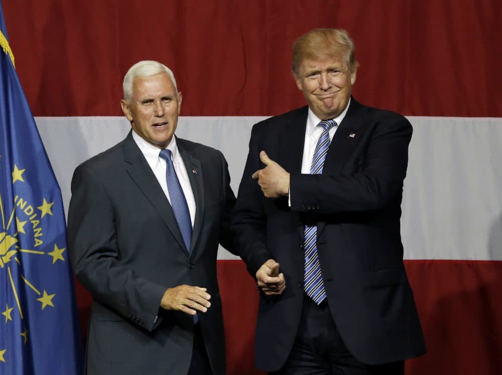 Indiana Gov. Mike Pence with Republican presumptive presidential candidate Donald Trump at a rally in Indiana. (Michael Conroy/AP)