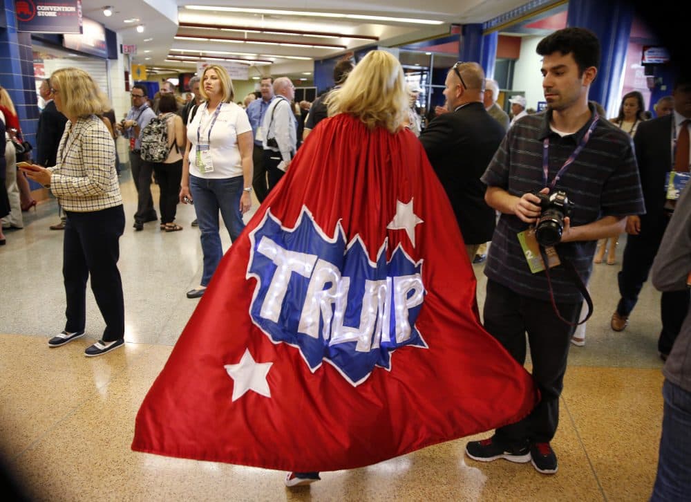 Minnesota delegate Mary Susan walks around the hallway in her Trump cape at Quicken Loans Arena before the start of the second day of the Republican National Convention. (Matt Rourke/AP)