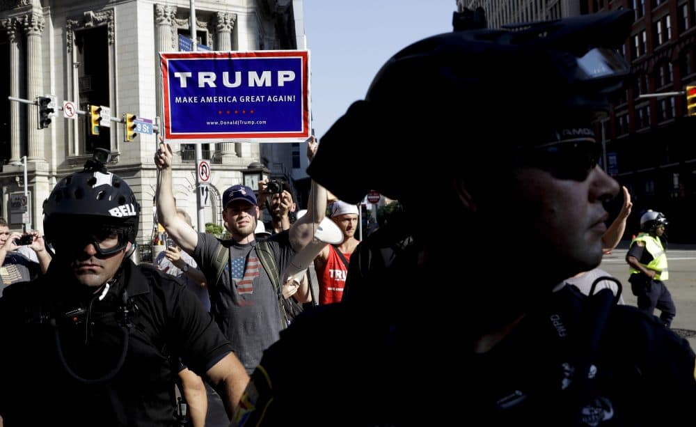 A supporter of Republican presidential candidate Donald Trump marches in downtown Cleveland Tuesday. (Patrick Semansky/AP)