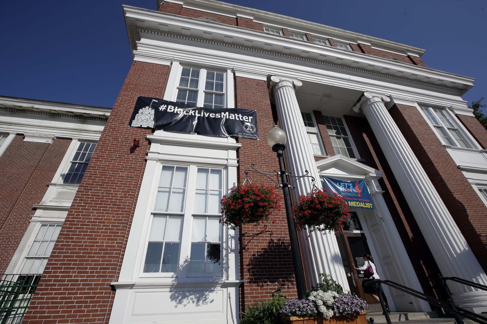 A "Black Lives Matter" banner hangs at the main entrance of Somerville City Hall Thursday. (Steven Senne/AP)