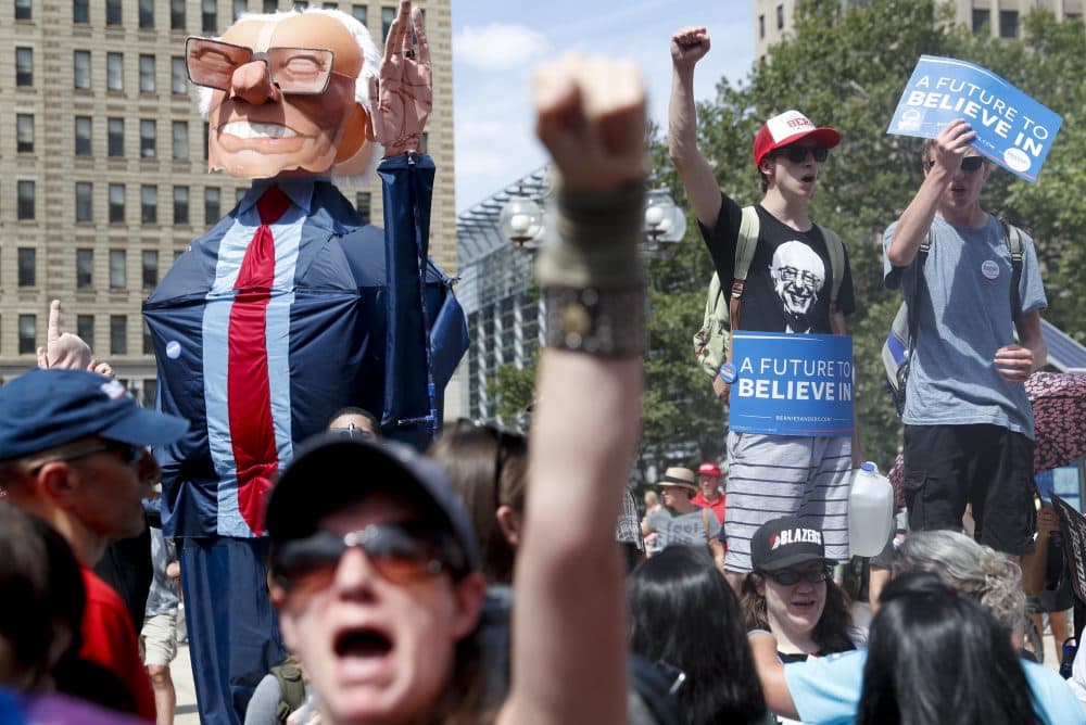 Sanders supporters march through downtown Philadelphia Sunday ahead of the DNC. (John Minchillo/AP)