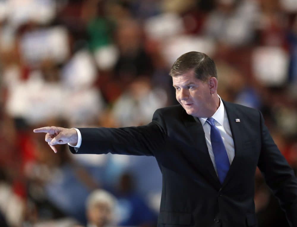 Boston Mayor Marty Walsh points as he exits the stage after speaking during the first day of the Democratic National Convention. (Paul Sancya/AP)