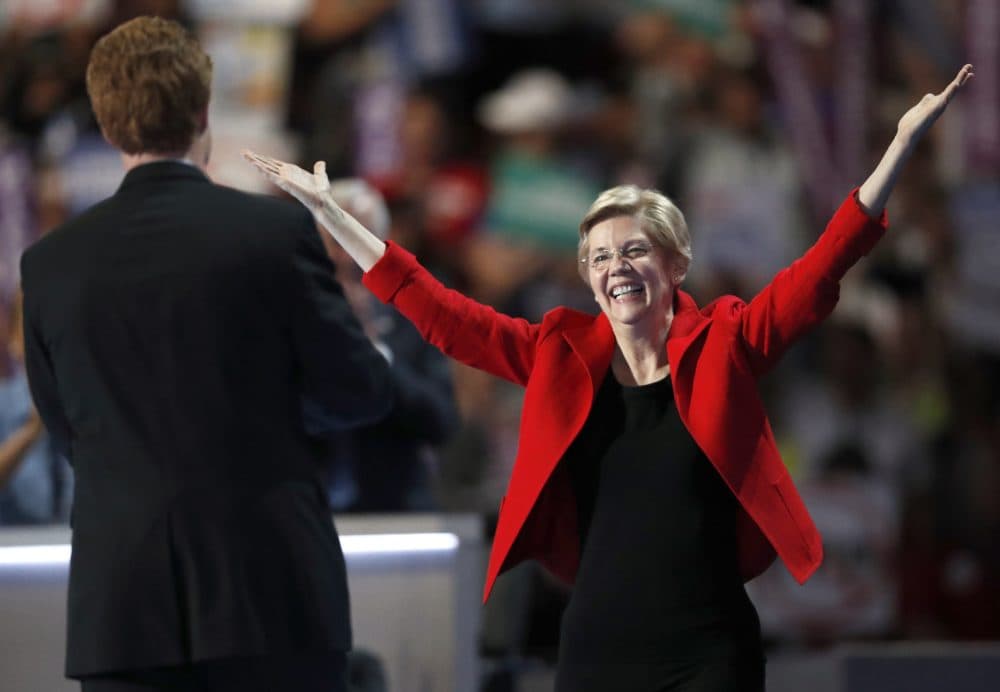 Sen. Elizabeth Warren greets Rep. Joe Kennedy after he introduced her to the DNC crowd. (Paul Sancya/AP)