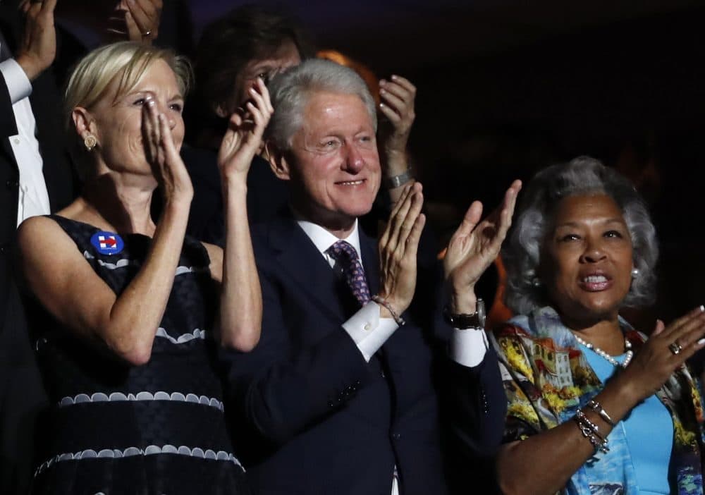 Former President Bill Clinton applauds Bernie Sanders. (Paul Sancya/AP)