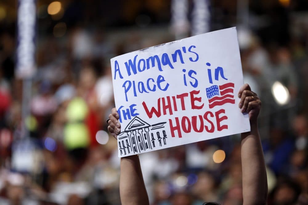 A delegate holds up a sign during the final day of the Democratic National Convention. (Carolyn Kaster/AP)